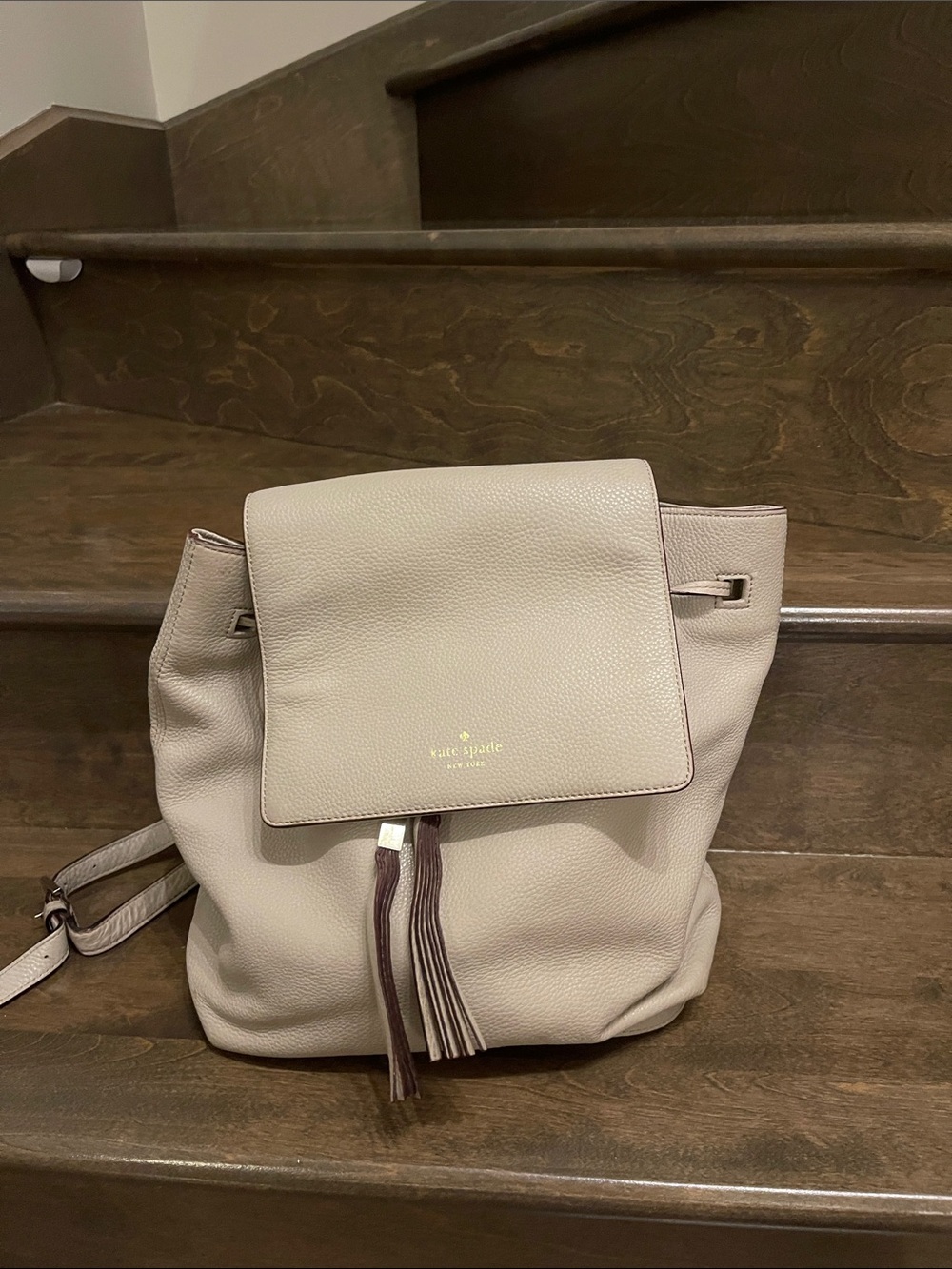kate spade pebble leather flap backpack in light taupe and tassel